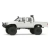 toyota hilux 96 wpl c64 auto rc escala 1-16 sobre superficie rocosa o fondo blanco