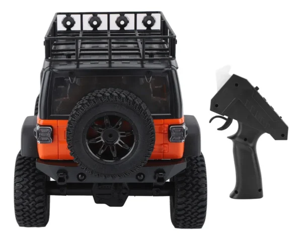 jeep rubicon mn128 auto rc escala 1-12 en fondo natural o sobre terreno rocoso