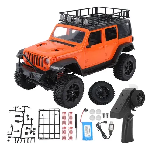 jeep rubicon mn128 auto rc escala 1-12 en fondo natural o sobre terreno rocoso
