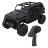 jeep rubicon mn128 auto rc escala 1-12 en fondo natural o sobre terreno rocoso