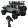 jeep rubicon mn128 auto rc escala 1-12 en fondo natural o sobre terreno rocoso