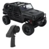 jeep rubicon mn128 auto rc escala 1-12 en fondo natural o sobre terreno rocoso