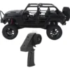 jeep rubicon mn128 auto rc escala 1-12 en fondo natural o sobre terreno rocoso