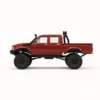 toyota hilux 96 wpl c64 auto rc escala 1-16 sobre superficie rocosa o fondo blanco