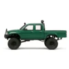 toyota hilux 96 wpl c64 auto rc escala 1-16 sobre superficie rocosa o fondo blanco