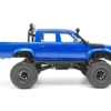 toyota hilux 96 wpl c64 auto rc escala 1-16 sobre superficie rocosa o fondo blanco