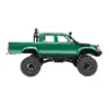 toyota hilux 96 wpl c64 auto rc escala 1-16 sobre superficie rocosa o fondo blanco
